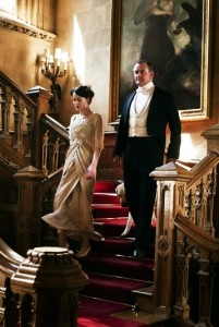 Lady Mary and Lord Crawley descend stairs